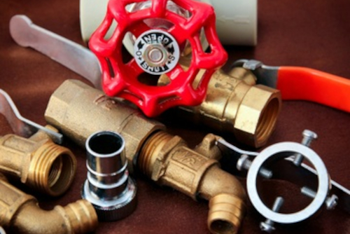 assorted-brass-plumbing-valves-fittings-and-tools Collection of brass plumbing valves, fittings, and pipe tools on a surface</p>
<p>